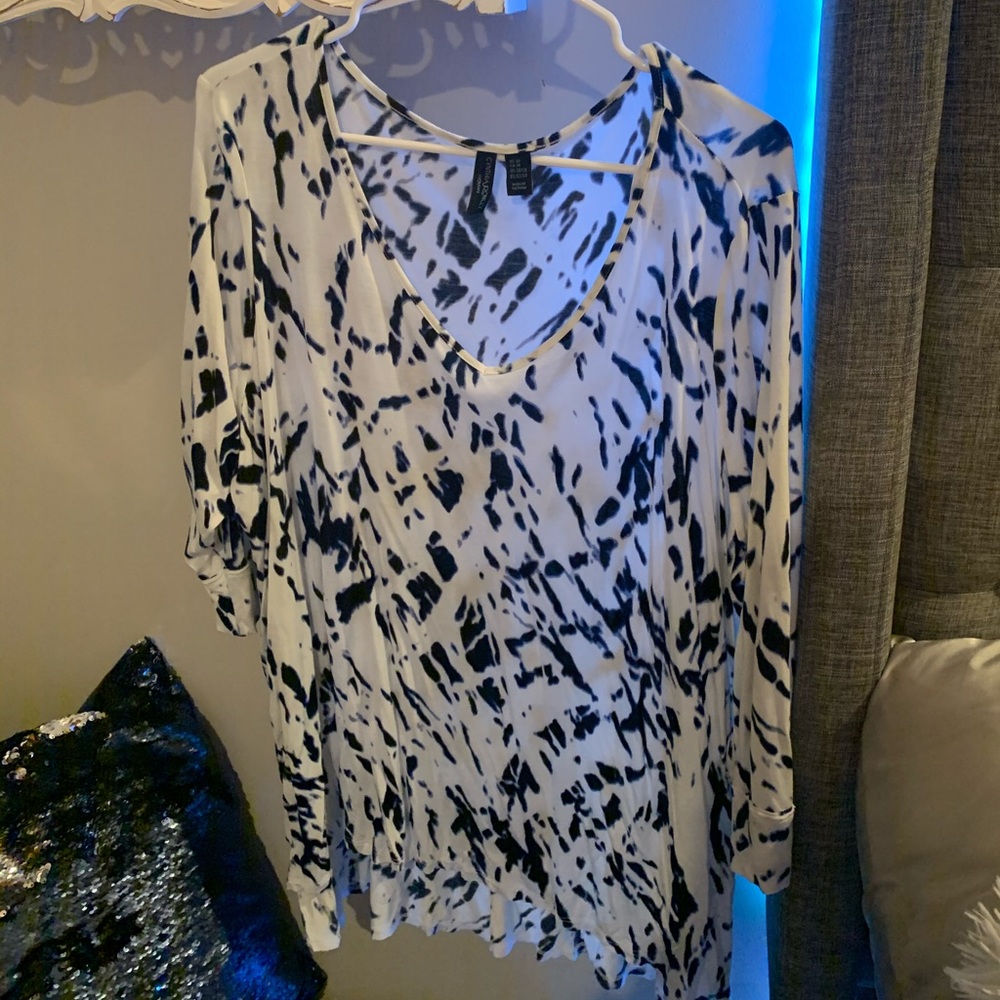 Navy blue and white patterned blouse